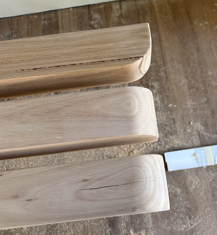 Sculptural timber stair treads featuring bullnose edges and natural grain, crafted from premium solid European oak.